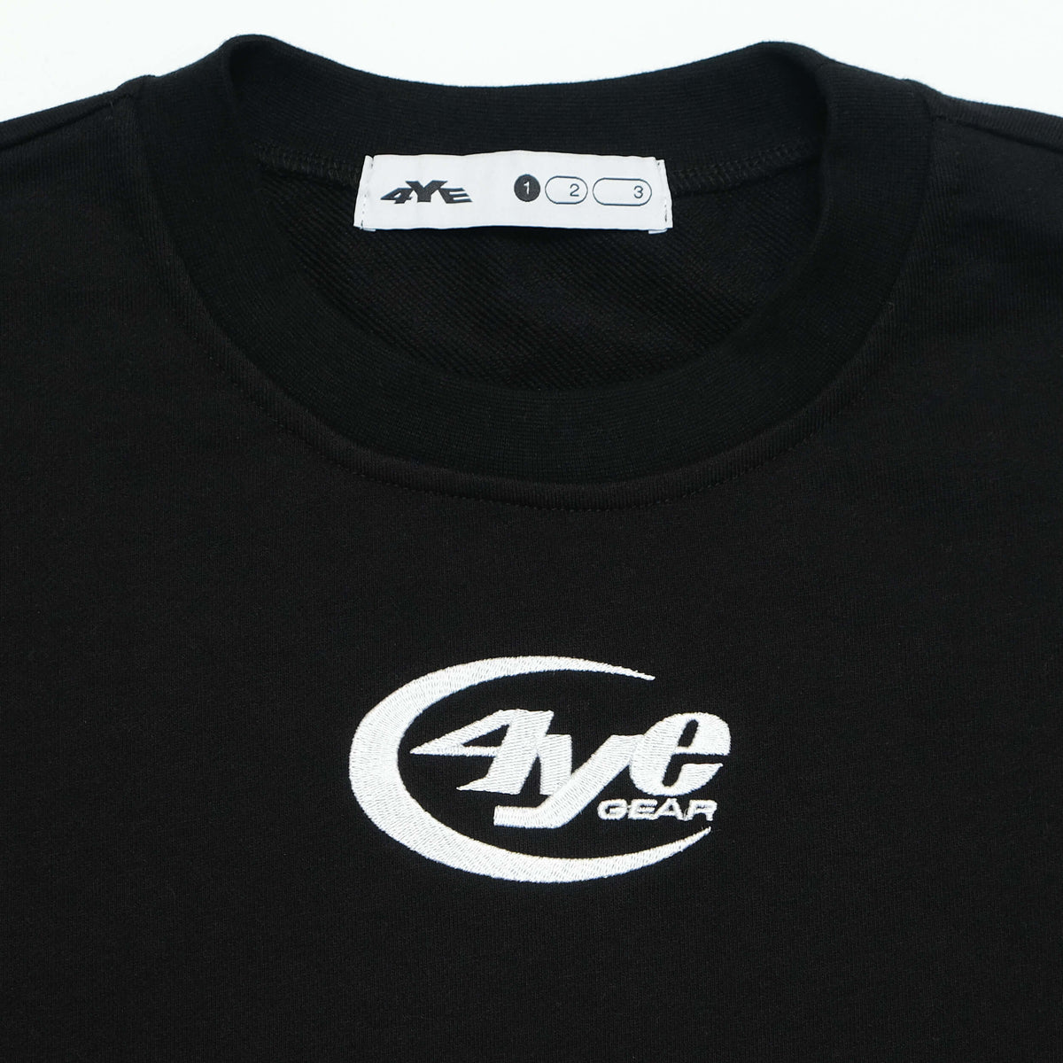 Detail image of the 4YE Gear Logo in white on the Raw Hem Crew