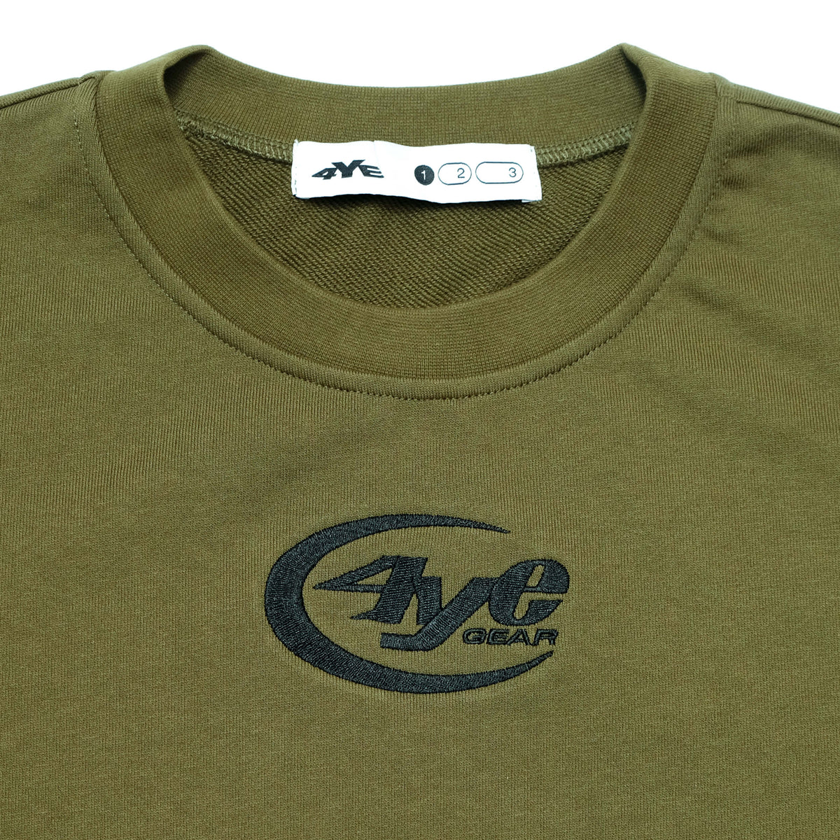 Detail image of the 4YE Raw Hem Crew in Olive, showing close up of the stitched 4YE gear logo 